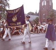 Mary Jane carrying banner on the right