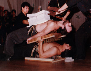 Sifu Kwan, on bottom - nail bed demonstration