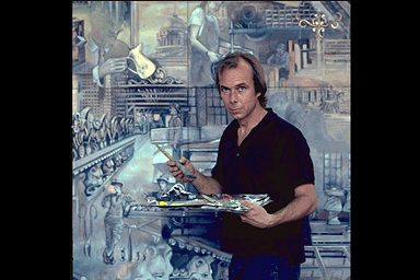 Image of the artist in front of a mural