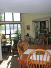 Dining / living room of condo; view of lake outside