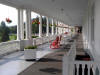 Large porch overlooking front of hotel
