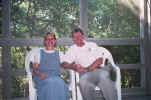 Nancy and Ken sitting on screened porch in vacation villa at Kiawah Island, SC.