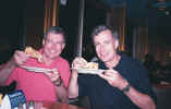 Ken and David enjoying late night pizza on cruise to Bermuda.