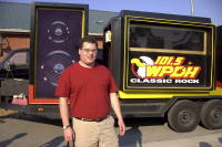 Tom next to radio station truck